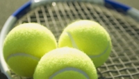 Photo of tennis balls and racket